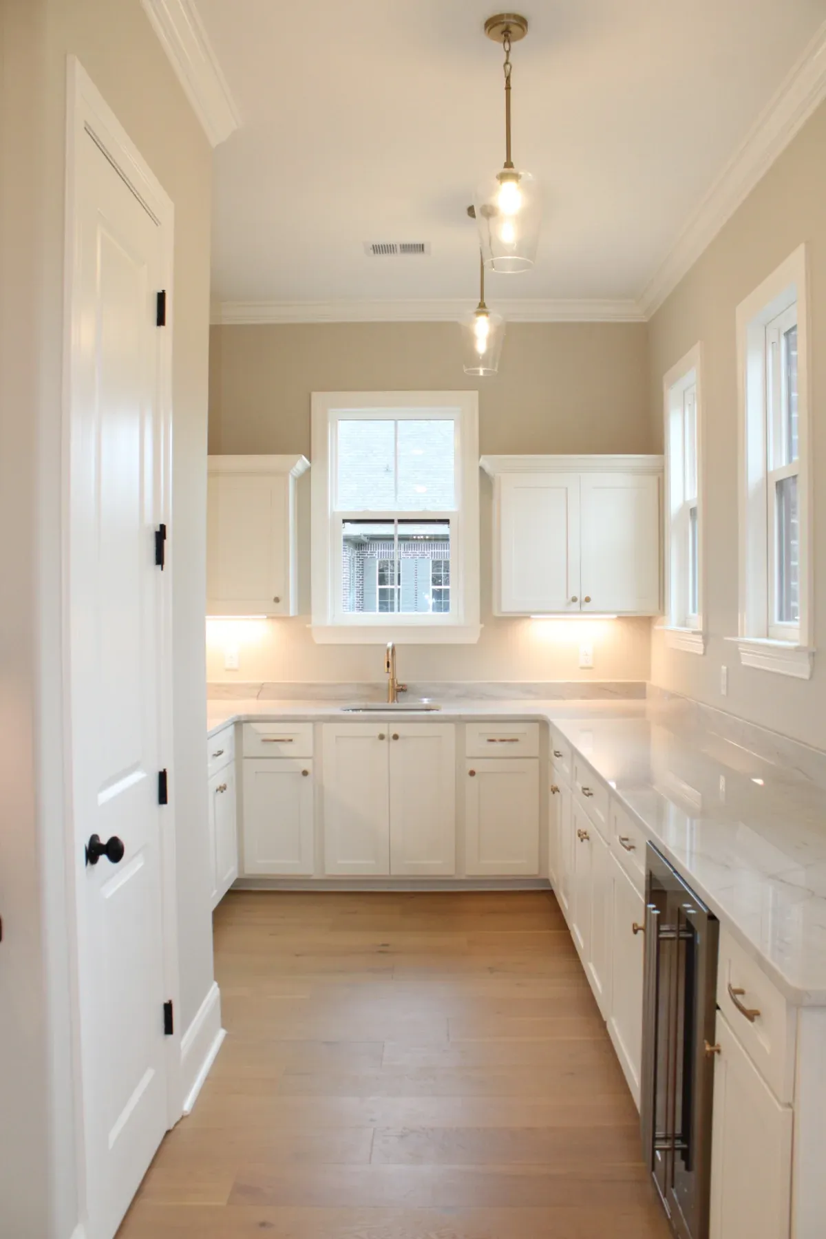 Beautiful modern kitchen with white cabinets.