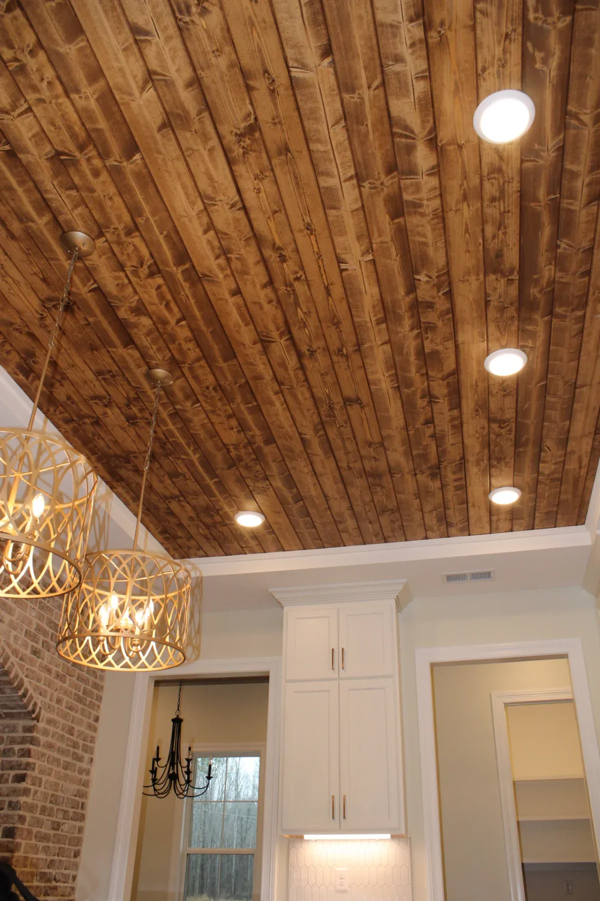 Beautiful wood panel celing installed.