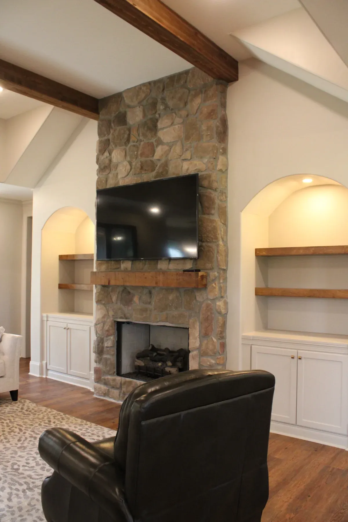 Classic design living room with stone fireplace.