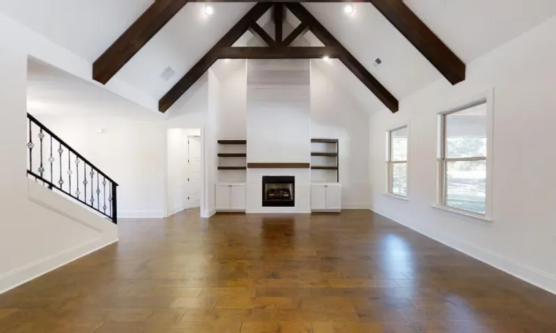 Wood beams align the ceiling in this custom home.
