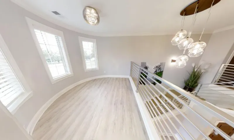 This home offers a modern aluminum railing throughout the stairs and loft.