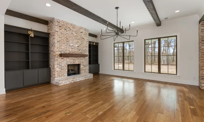 Custom home with fireplace and double book cases.